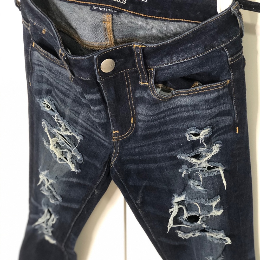 Ripped denim jegging skinny mid rise